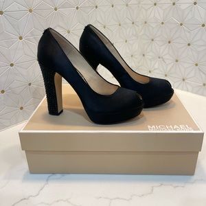 Black satin pumps with rhinestone heels